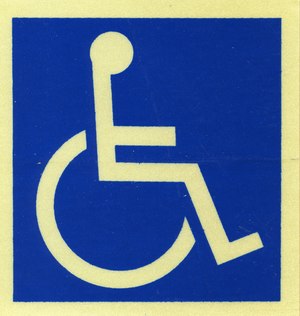 Symbole représentant une personne en fauteuil roulant. 